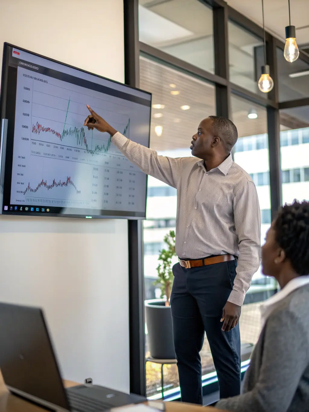 A confident financial advisor discussing wealth plans with a client in an office setting, emphasizing trust and personalized service.